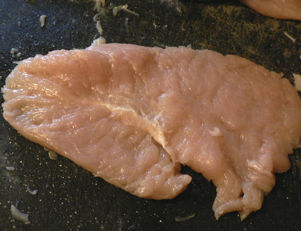 Chicken Breast on a Cutting Board