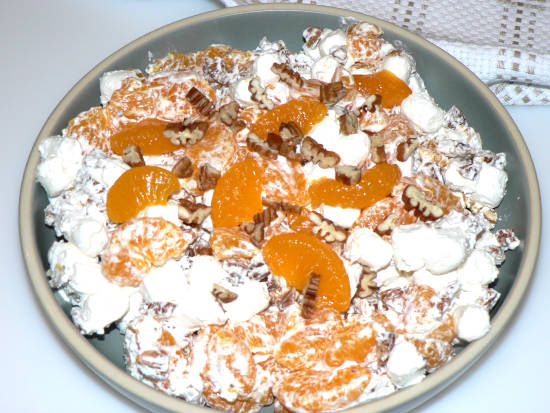 Ambrosia Salad in a Bowl on white surface