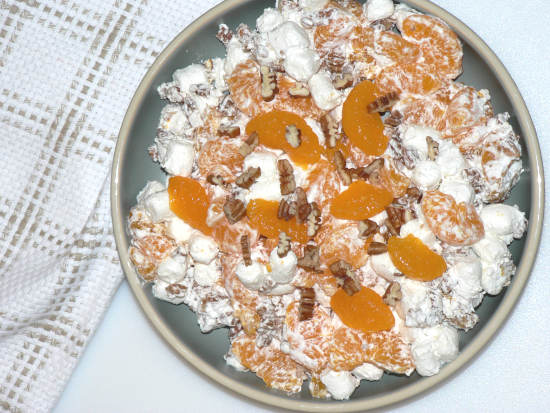 Ambrosia Salad in a Bowl on white surface