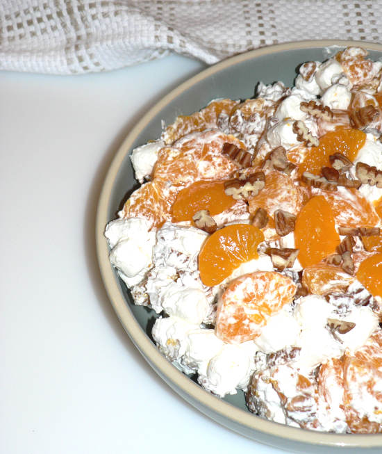 Ambrosia Salad in a Bowl on white surface