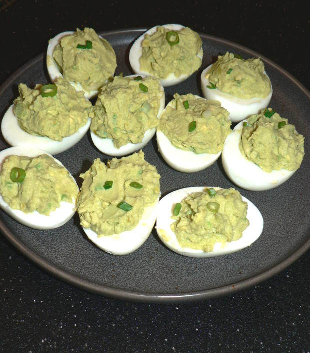 Green Avocado Deviled Eggs on a Plate
