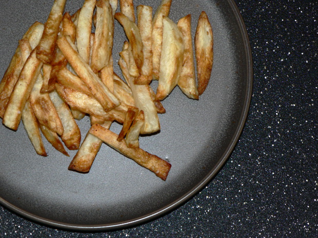 French Fries Air Fryer on a grey plate with spots