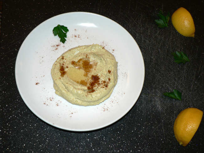 Hummus on a white plate