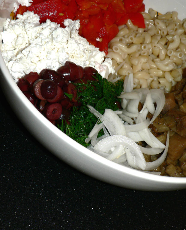 Best Greek pasta salad, all the ingredients separately in a mixing bowl