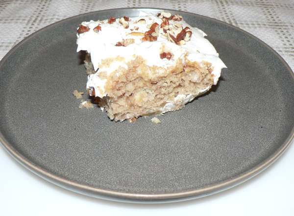 Caramel Apple Poke Cake on a grey plate