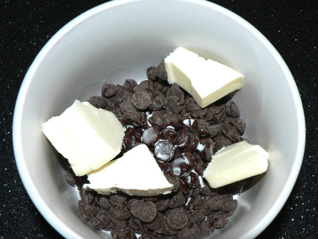 Chocolate Chips, Cream, Butter in a mug