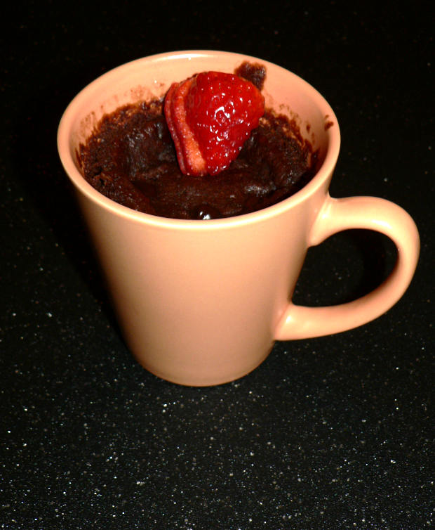 Microwave chocolate cake with a strawberry on top
