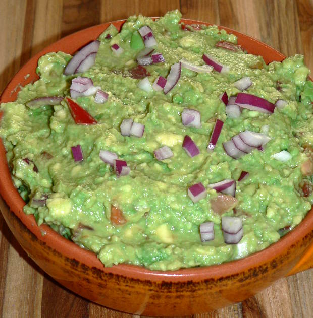 Guacamole in an orange dish