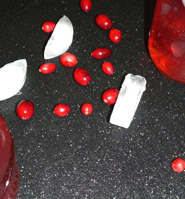 Cranberries and Ice on a cutting board