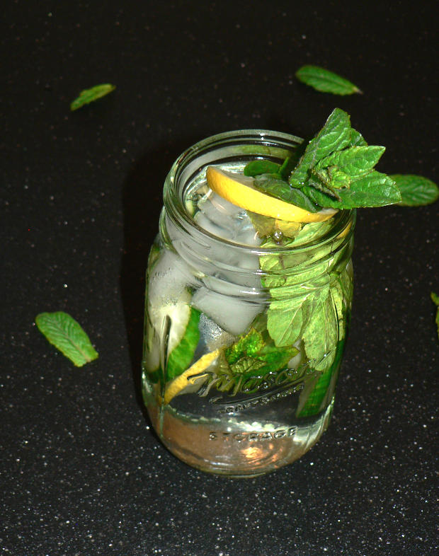 Cucumber, Lemon Water in a Mason Jar, with ice and sprigs of mint