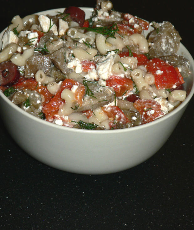 Greek pasta salad in a grey bowl