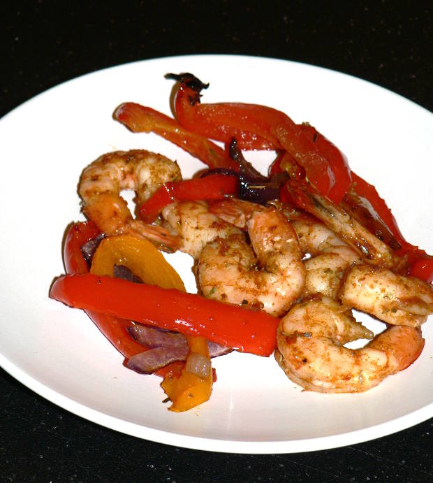 Cajun Shrimp, Peppers and Onions on a White Plate