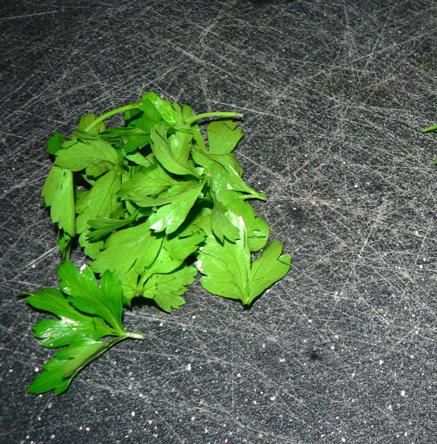 Parsley on a Black Cutting Board