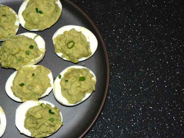 Green Avocado Deviled Eggs on a Plate