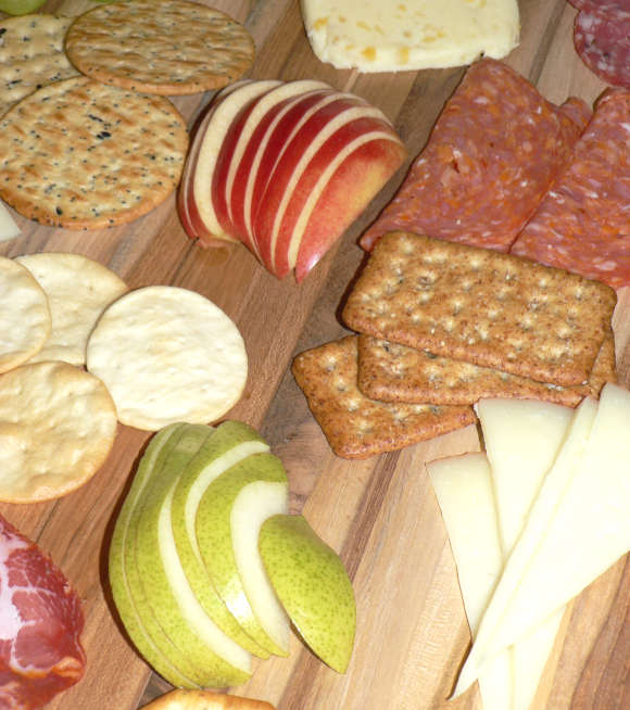 Cheeses, meats and fall fruits on Charcuterie Board