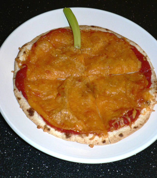 Pumpkin pizza on a white plate