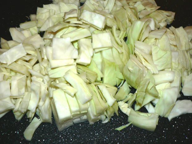 Raw Chopped Cabbage On A Cutting Board