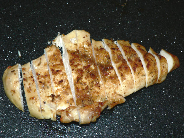 Air Fryer Lid Chicken Breast Slices on a Black Cutting Board