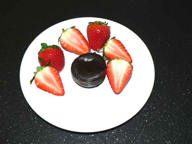 Chocolate Brownies on a White Plate with Strawberries