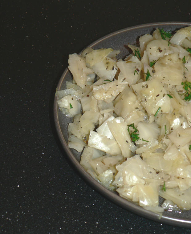 IP Cabbage On A Plate On A Black Cutting Board