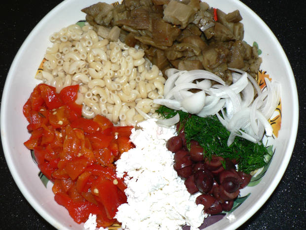Greek salad ingredients in a large salad bowl