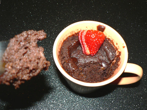A piece of microwave chocolate cake on a spoon
