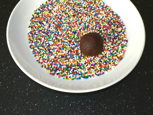 Rolling Chocolate Truffles in Rainbow Sprinkles