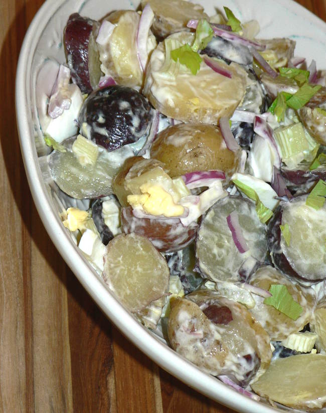 Red, White and Blue Potato Salad, find out the easiest recipe for making healthy and delicious potato salad instead of buying it at the store. Your potato salad with be a hit at the next barbecue! #healthy #healthyrecipes #healthyfood #healthyeating #cooking #food #recipes #vegetarian #vegetarianrecipes #vegetables #glutenfree #glutenfreerecipes #dairyfree #sidedish #potatoes #potatosalad