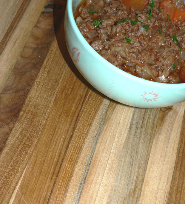 Pressure Cooker Unstuffed Cabbage in a Bowl on a Wooden Cutting Board