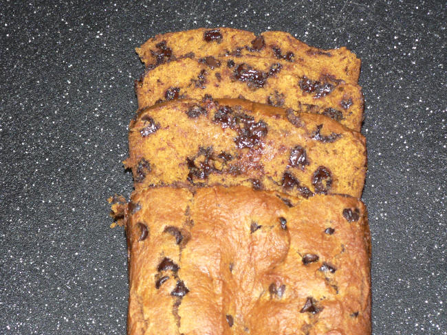 Pumpkin bread on black cutting board