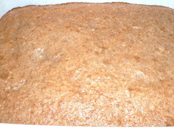 Baked Caramel Apple Poke Cake in a baking pan