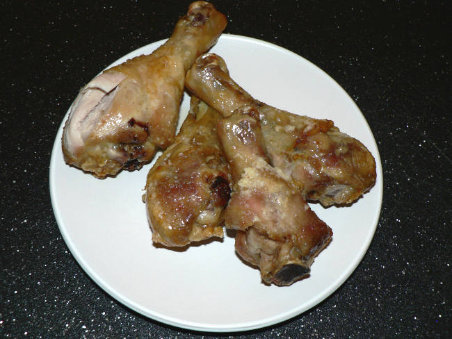 Air Fryer Lid Garlic Parmesan Chicken Drumsticks on a White Plate