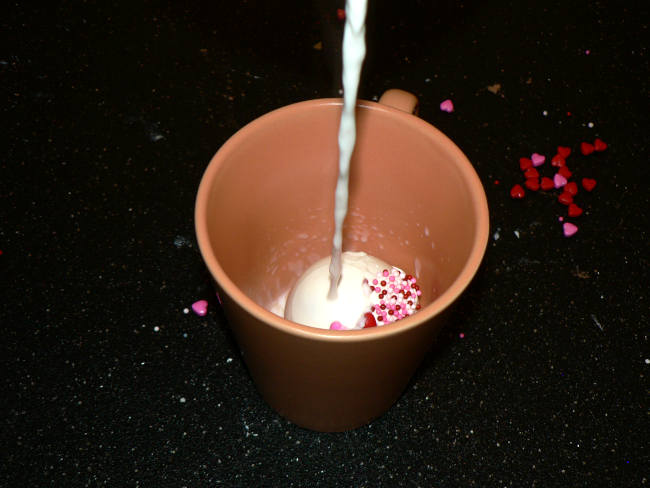 White Chocolate Hot Cocoa Bomb with Milk in a Mug