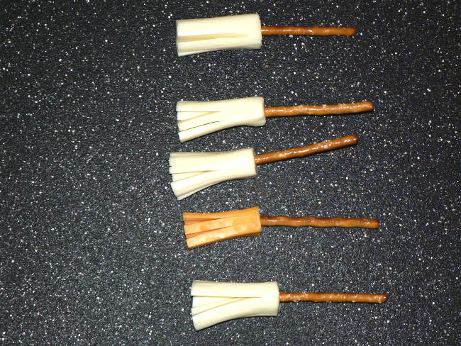 Witches broomsticks on a cutting board