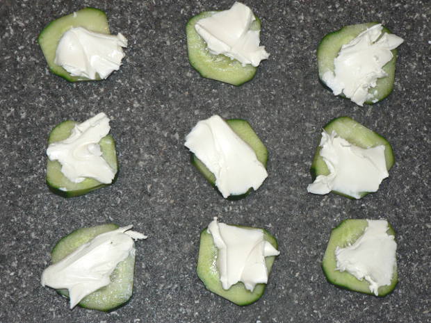 Cream cheese on top of cucumber bites