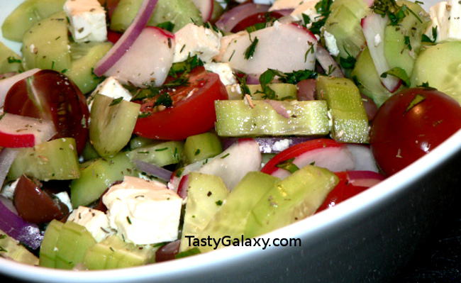 Best Greek Salad Recipe, made with radishes, cucumbers, tomatoes, olives, feta cheese, onions and more. You will not believe how easy it is to make this delicious Greek Salad Recipe! #greek #olive #onion #tomatoes #vegetarian #vegetables #vegetarianrecipes