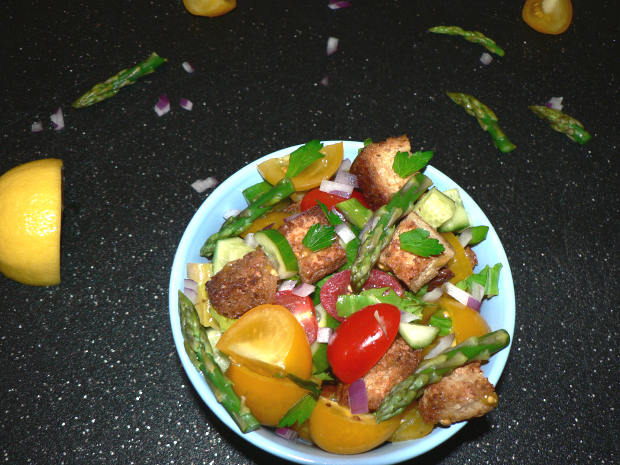 Panzanella Salad on a black cutting board