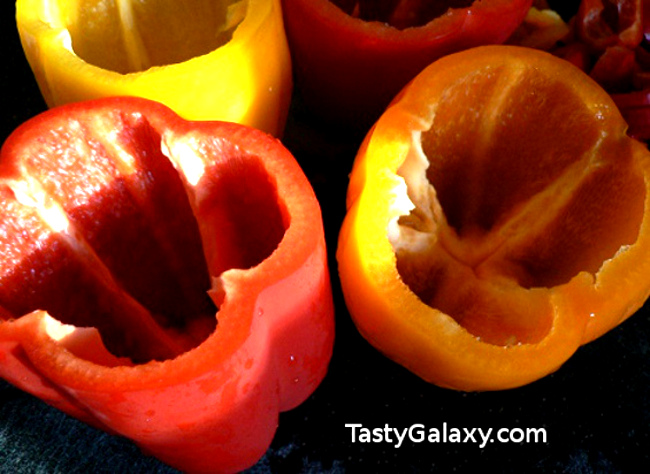 How to make stuffed peppers with ground beef, rice and colorful peppers. This easy to make, delicious and healthy recipe for stuffed peppers is going to become your go to dinner recipe! #stuffedpeppers