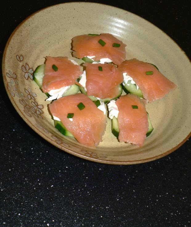 Smoked Salmon Cucumber Bites on a light brown plate
