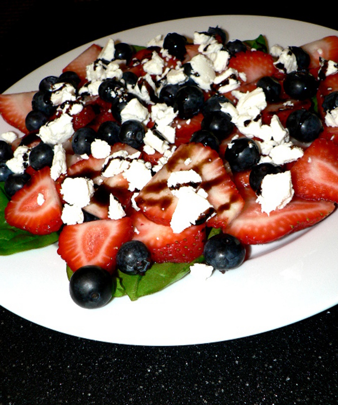 This spinach strawberry salad with blueberries and goat cheese is a perfect salad to make for the 4th of July and other patriotic holidays #salad #vegetarian